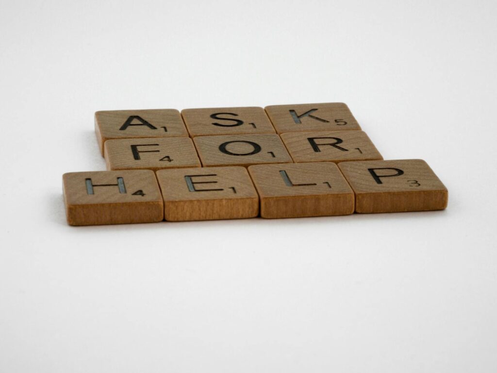 pexels photo 7478855 brown wooden scrabble tiles on white surface